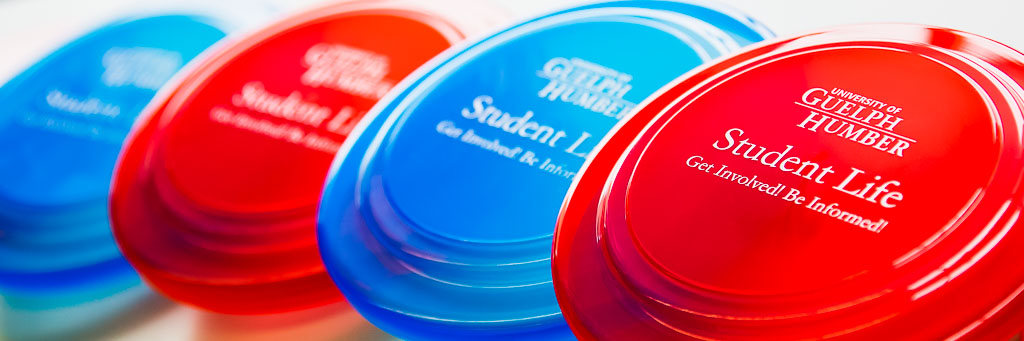Colourful throwing discs with student life labels.