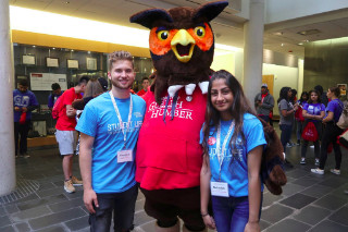 Two students with Swoop mascot