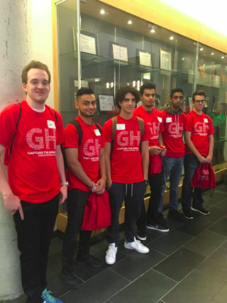 Six students in red orientation shirts