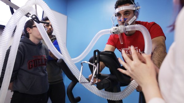 Student on exercise bike wearing VO2 Max testing equipment