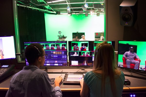 Two students sitting in video control room
