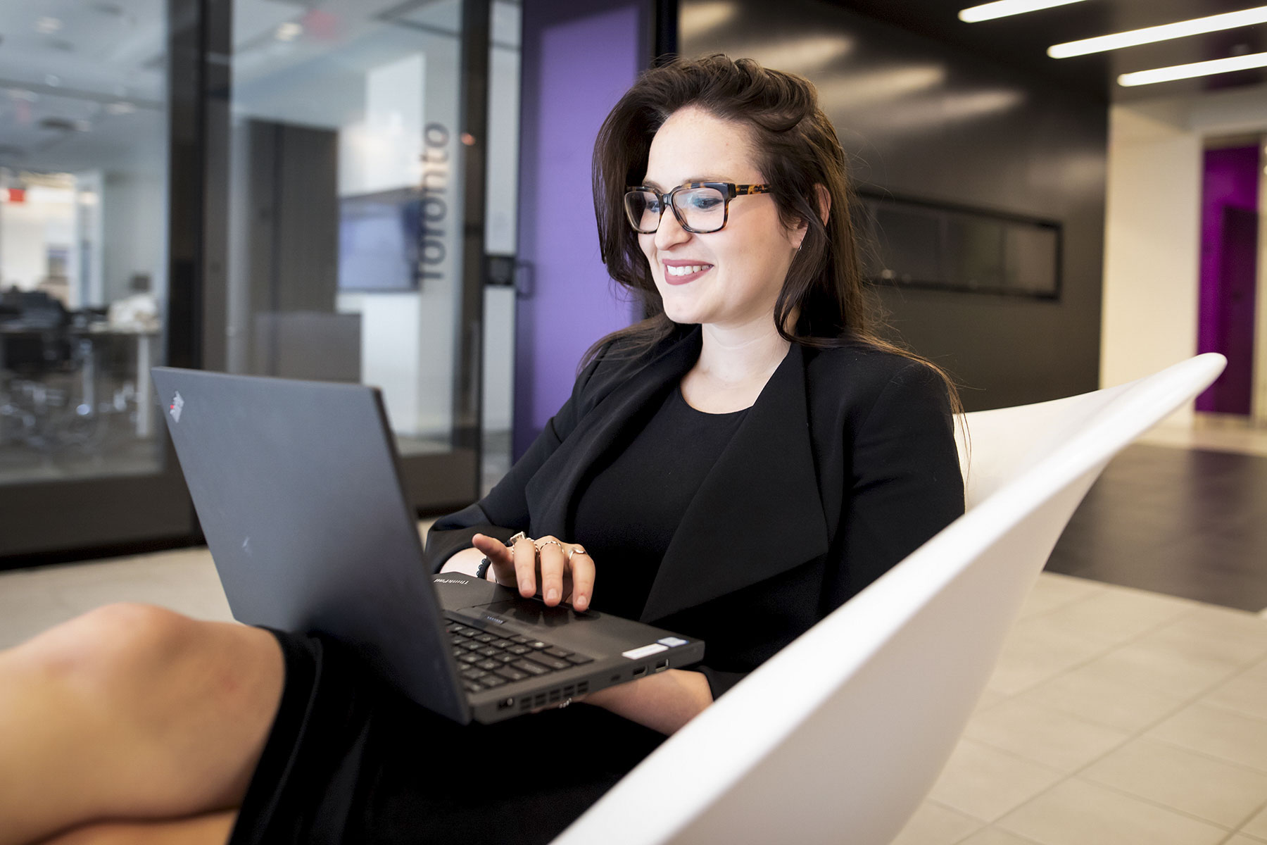 Danielle Jones on her laptop at the office