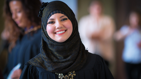 Smiling student at convocation 2014