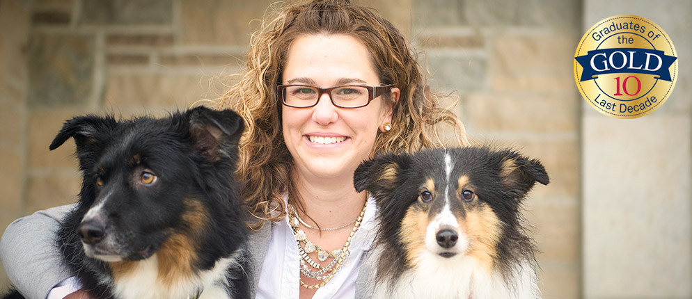 Adrienne McBride sits with her two dogs