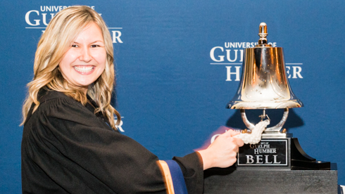 Portrait of Samantha Knight ringing UofGH Bell