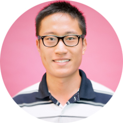 Portrait of research assistant Henry Quach on pink backdrop