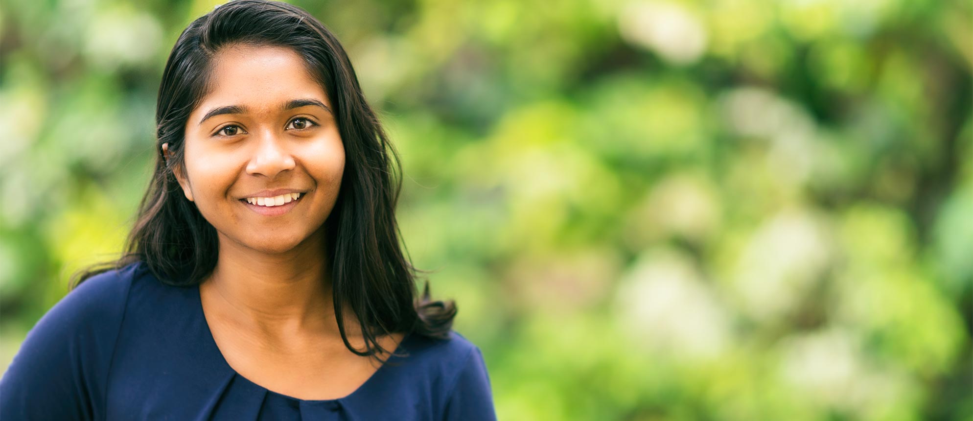 Priya Rajkumar smiles on campus