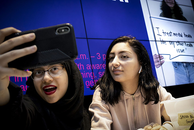 Two students pose for a selfie