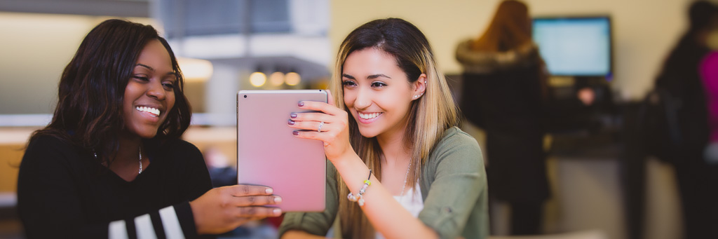 Students using tablet.