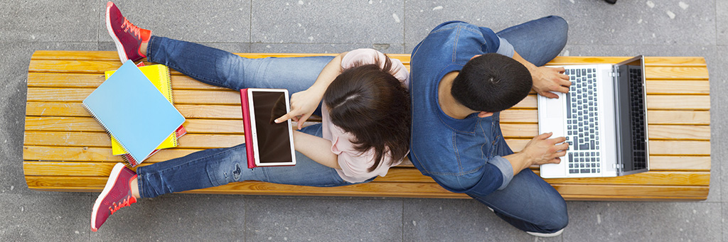 Overhead picture of students using laptops