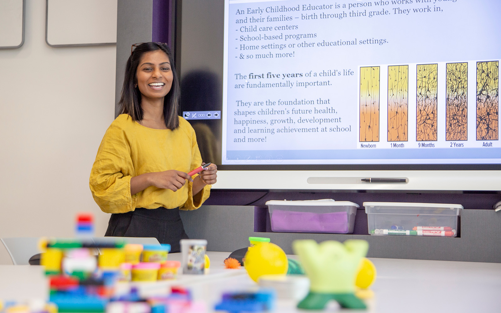 student in front of screen