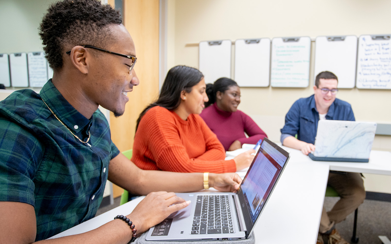 group of people on laptops