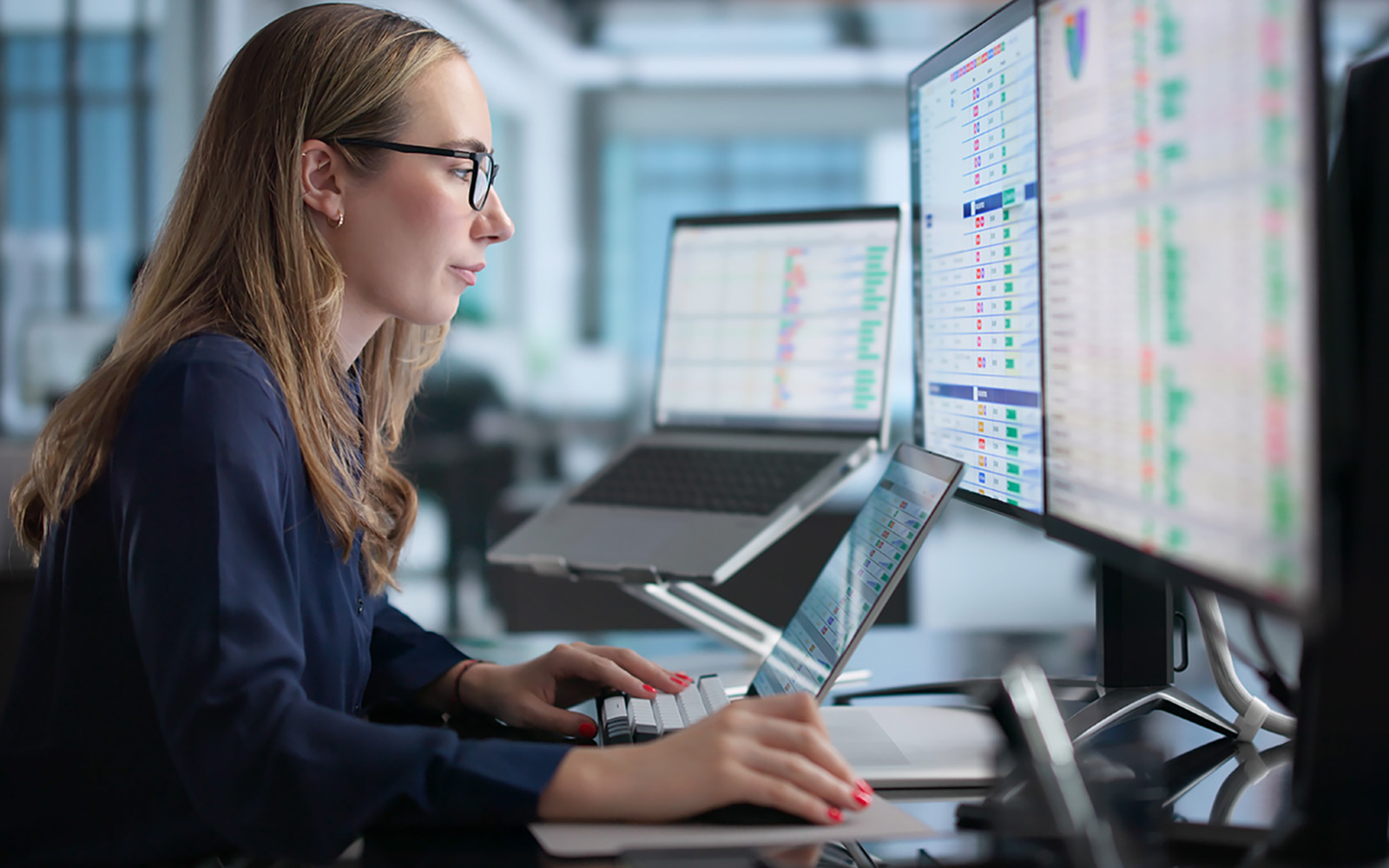 woman looking at charts on computer