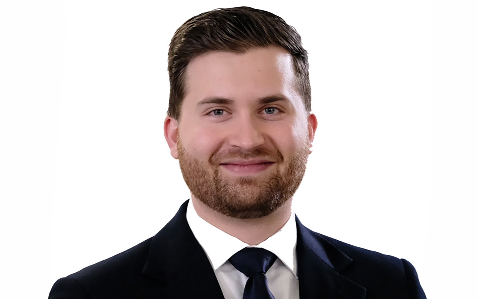 man with blonde hair in suit