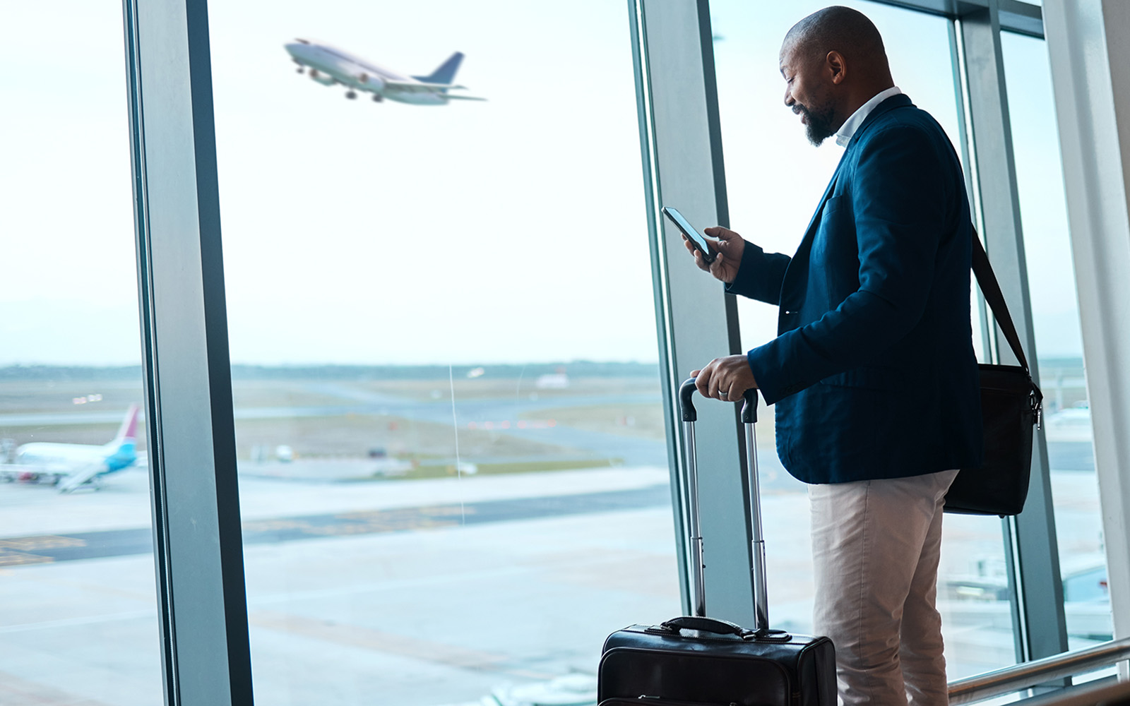 man with suitcase at airport