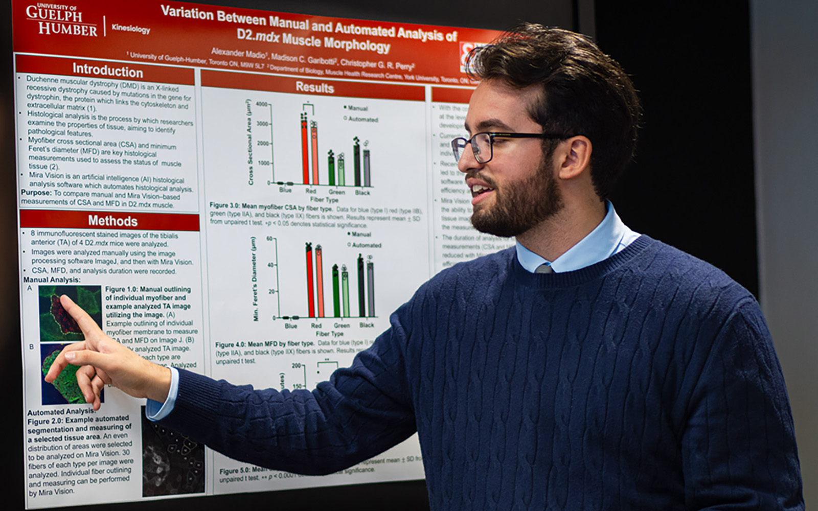 man in front of a research poster