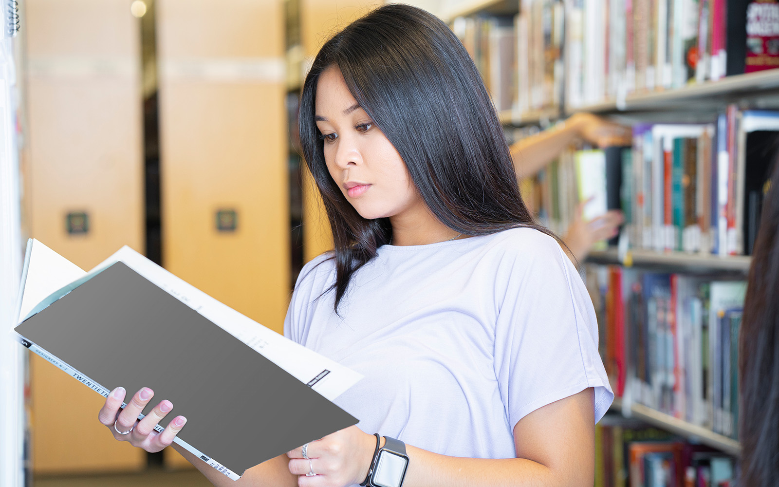 female student holding book
