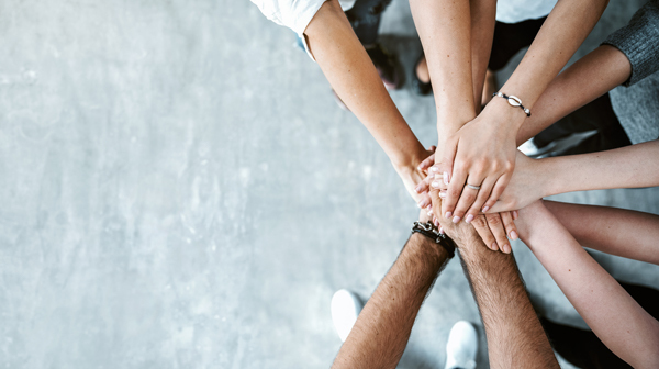 Students stack their hands