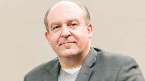 Gary Ellis poses on campus