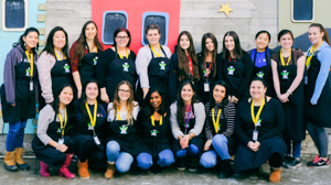 ECS students posing in front of Ronald McDonald House