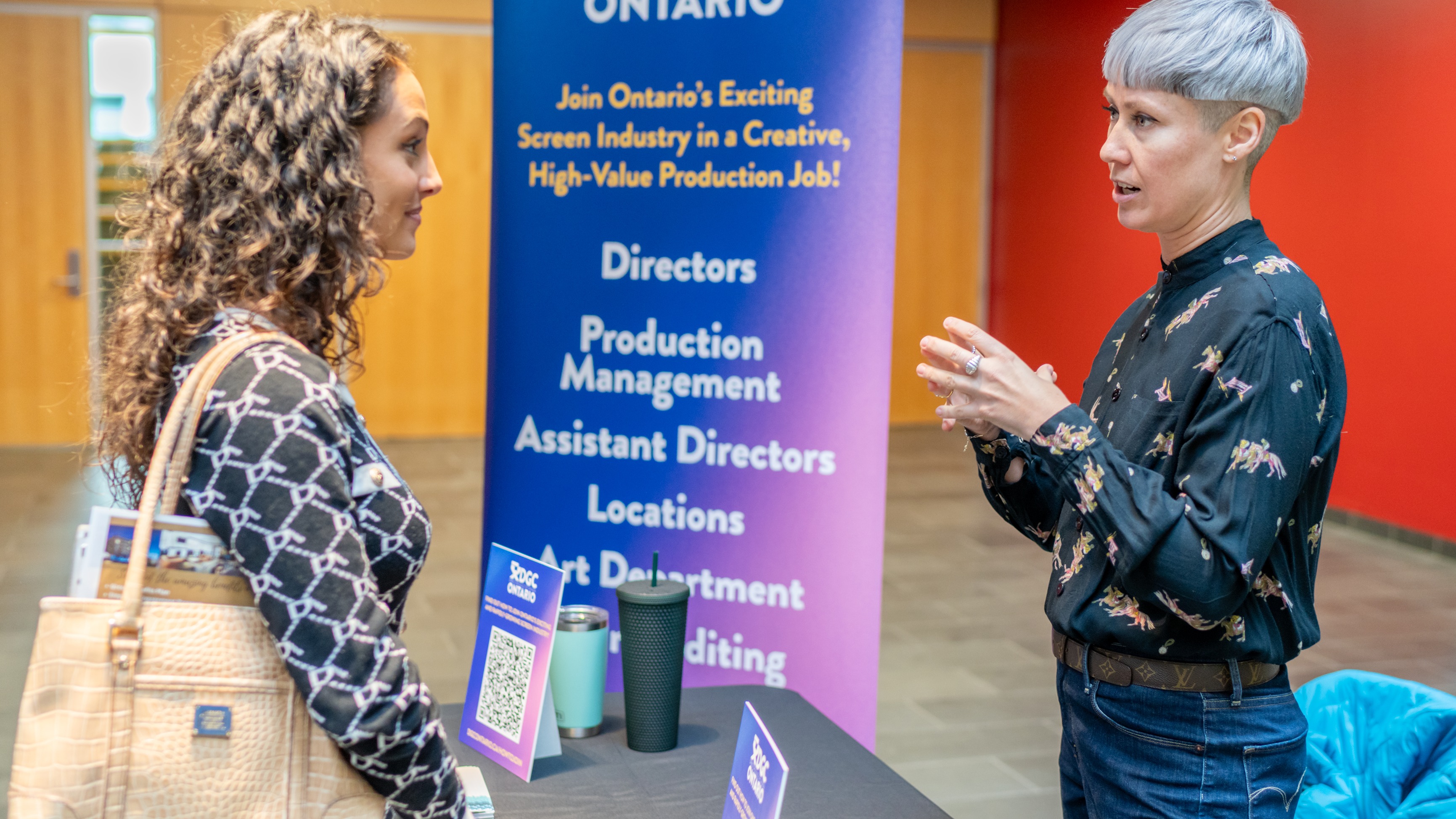 Student speaking with employer partner at a career fair