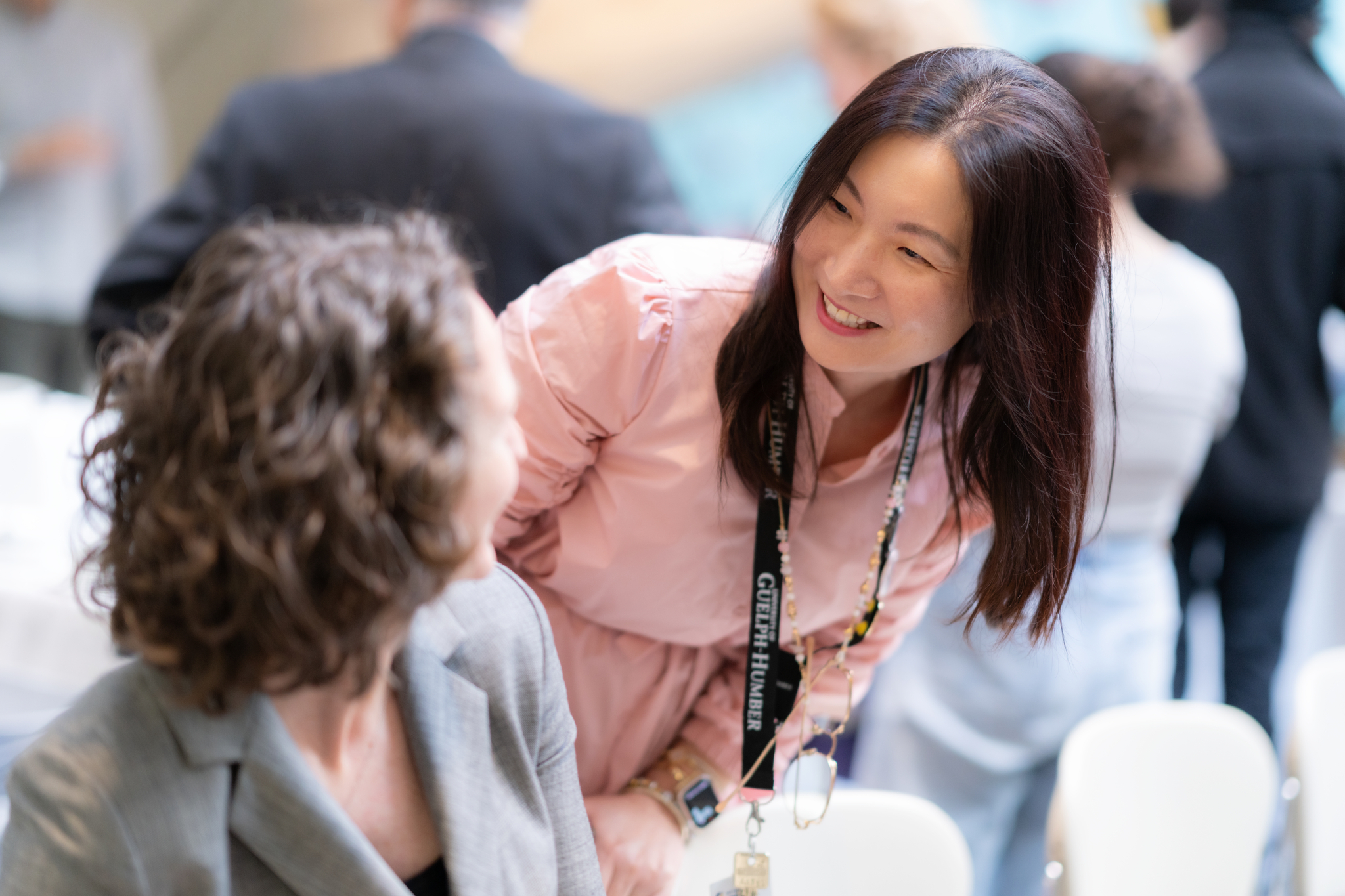 Two women looking at each other smiling