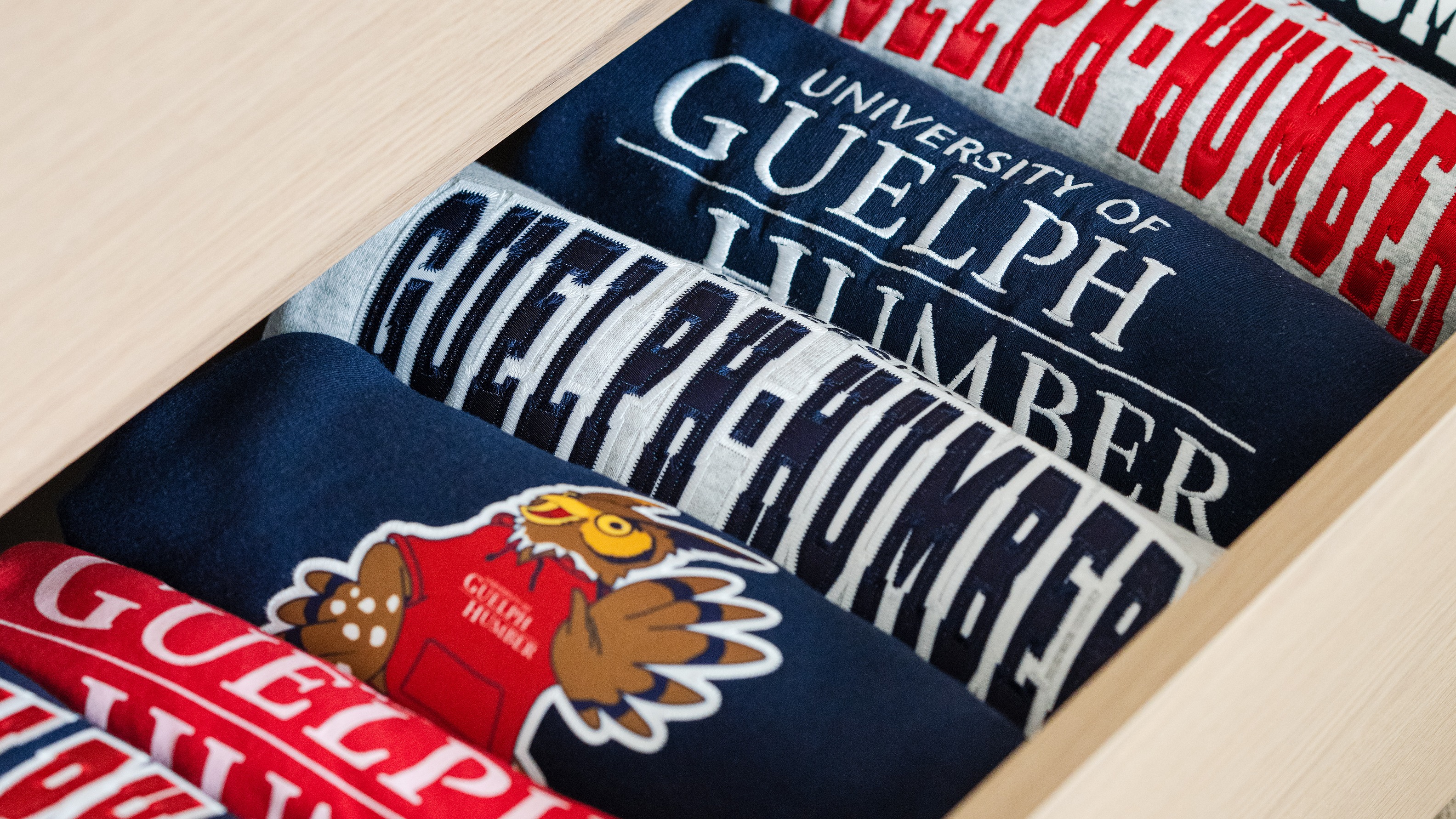 A drawer full of UofGH sweaters