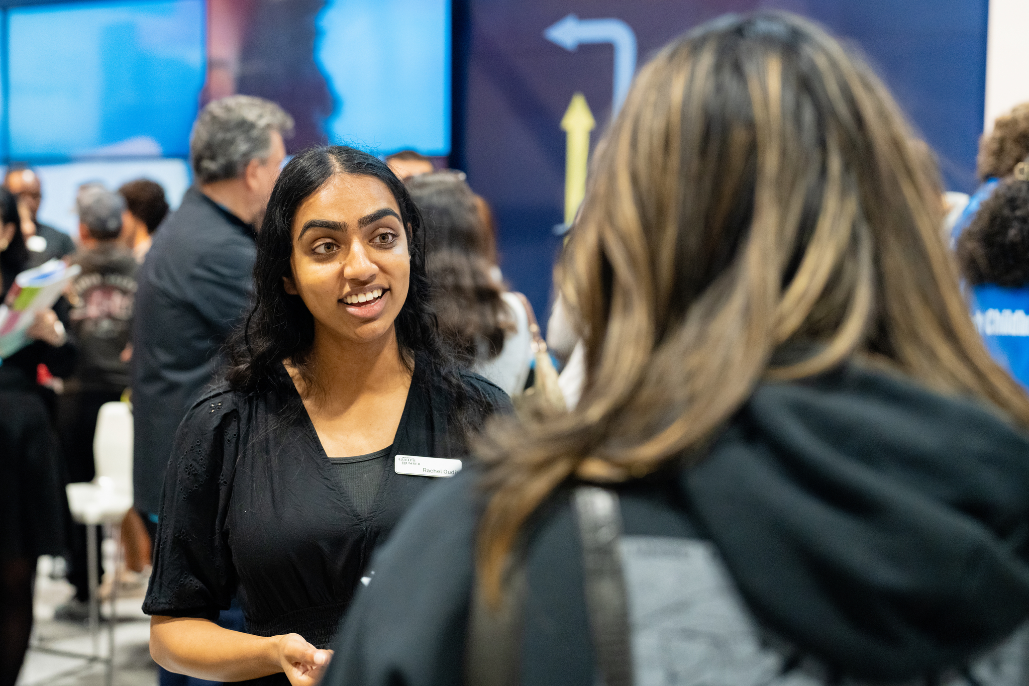 Two women speaking to each other