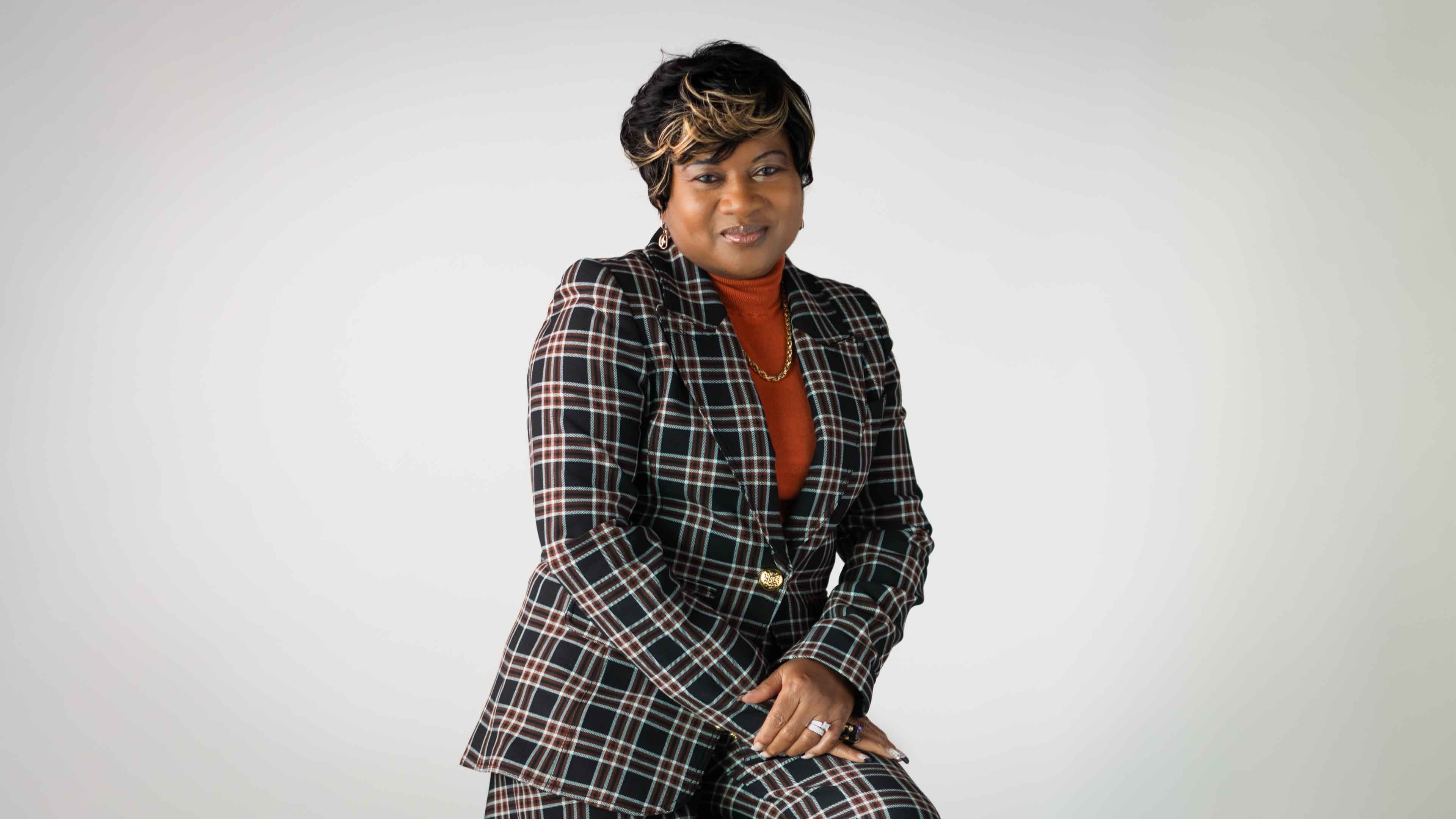 Woman wearing plaid suit