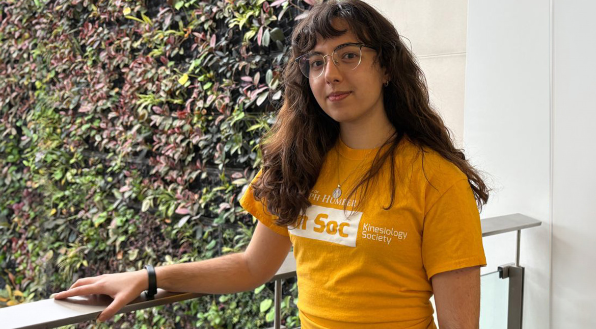 Chrysanthe Female student wearing yellow t-shirt