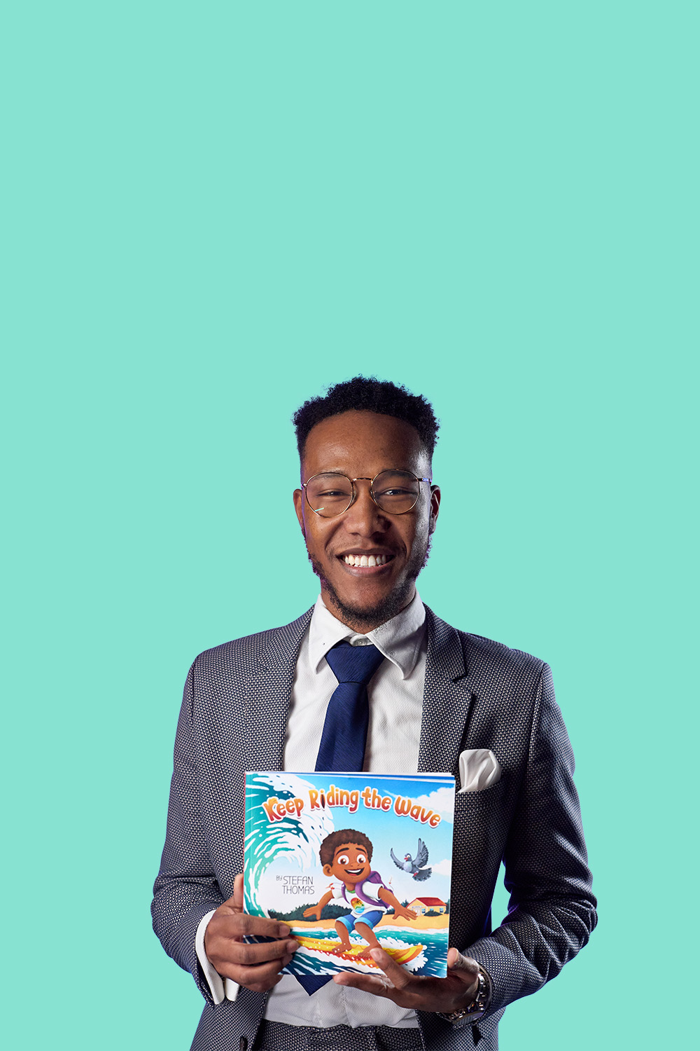 Stefan T. man in suit holding a book