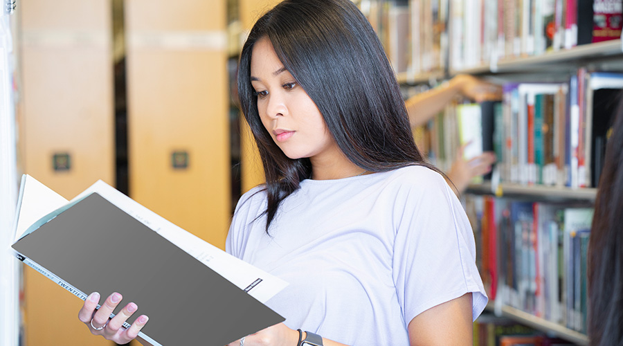 Research Student reading library book