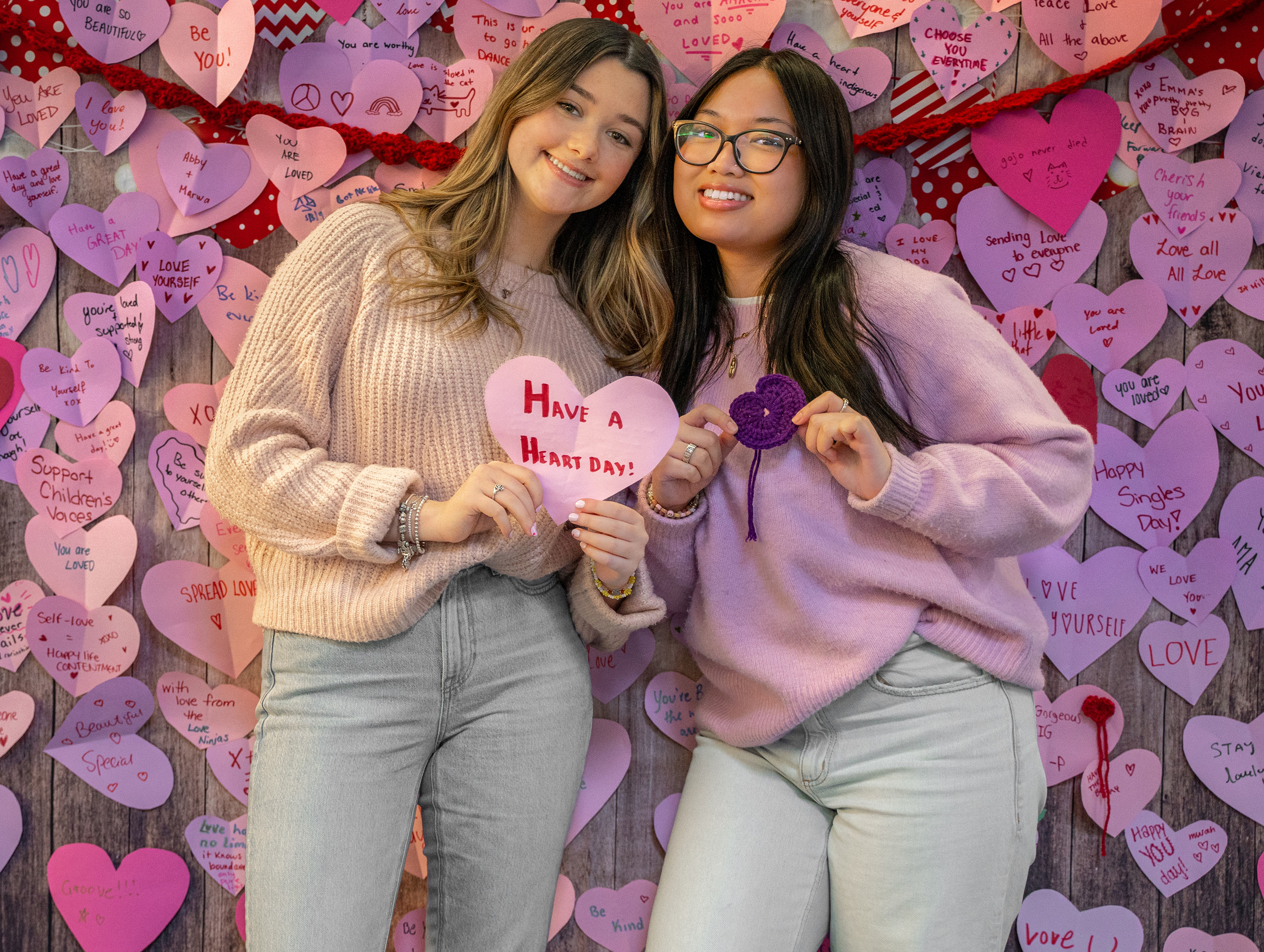 Two students holding valentines