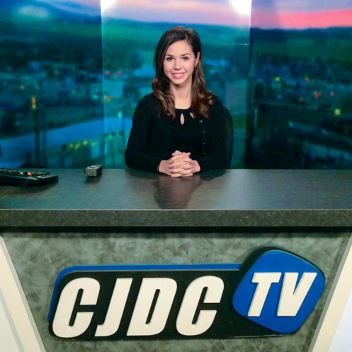 Natalie Quinlan behind CJDC TV desk