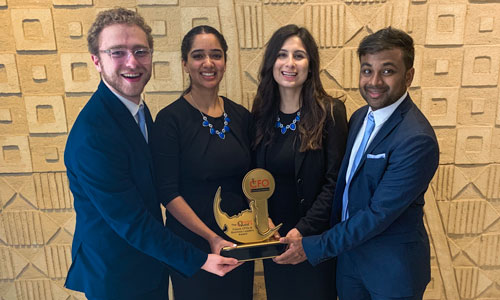 students holding trophy