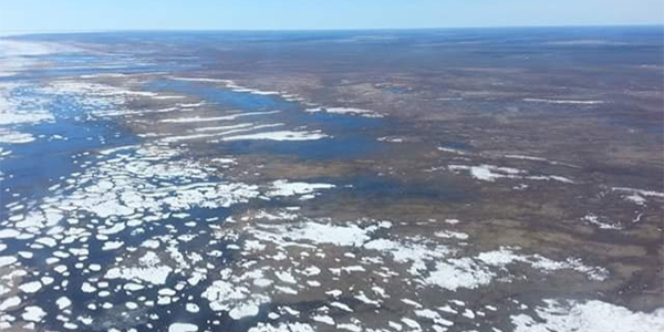 Student Aerial view of ground with snow lakes