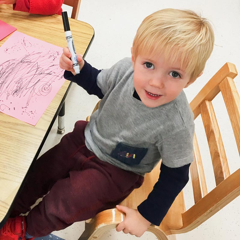 Child drawing with a marker