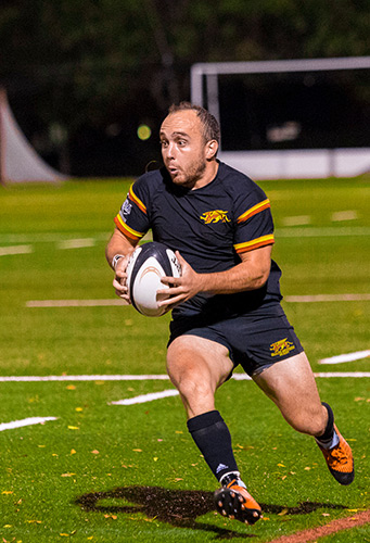Riley playing rugby
