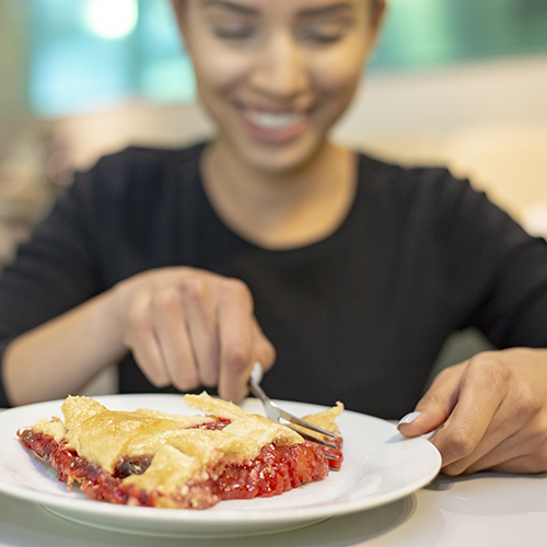 Student eating pie