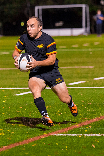 Riley playing rugby