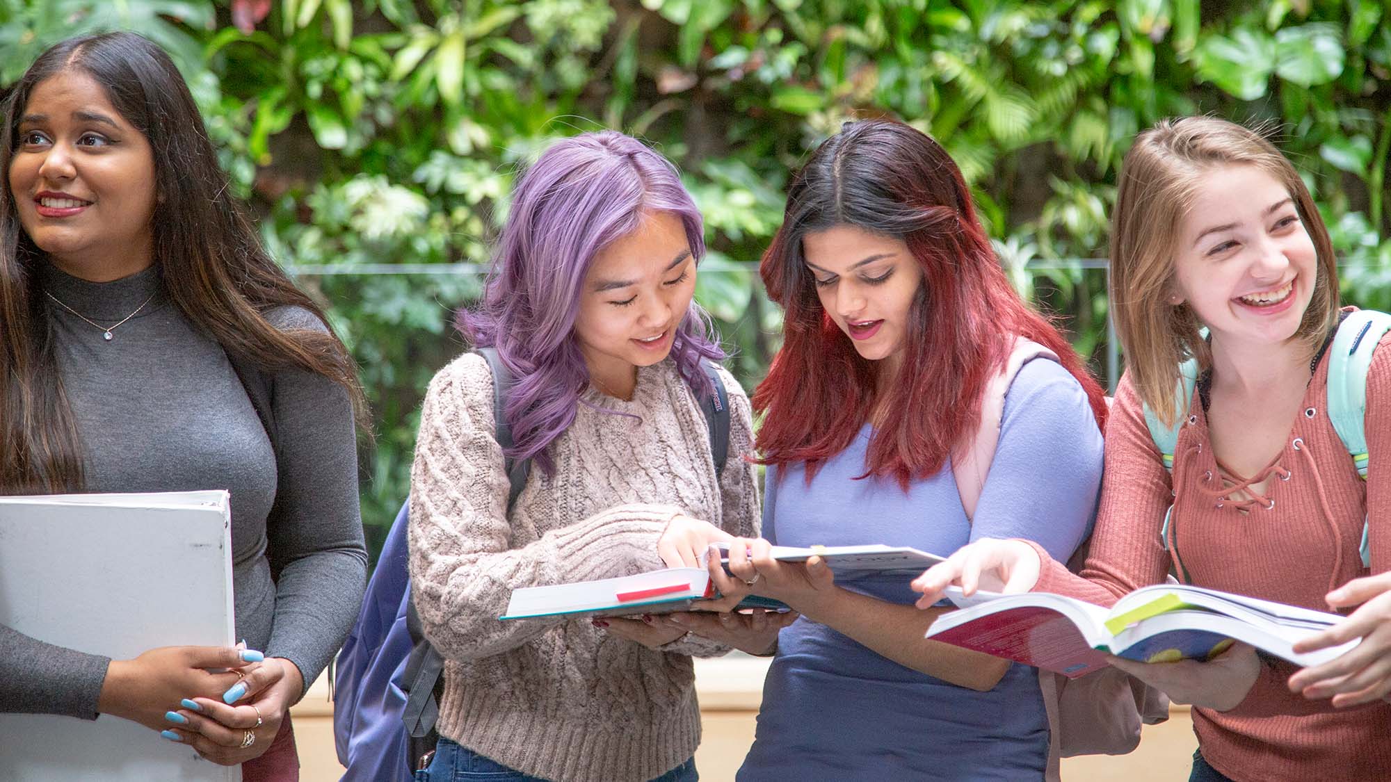 students reading textbook together