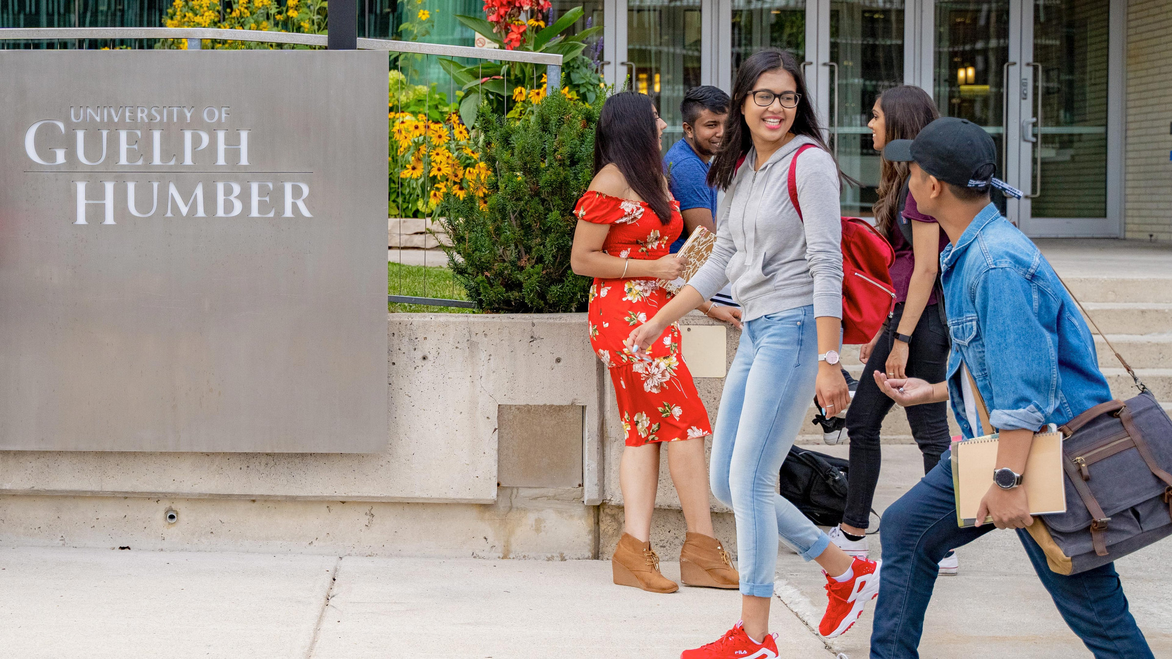 Group of students outside next to University of Guelph-Humber sign