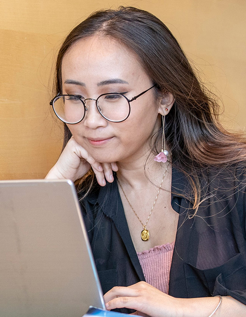 student looking at laptop