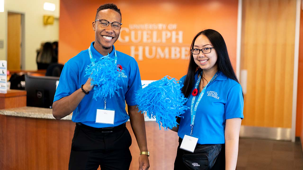 students with pom poms