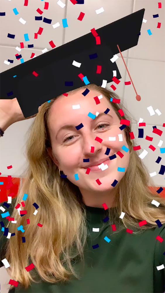Student selfie with confetti and superimposed graduation cap