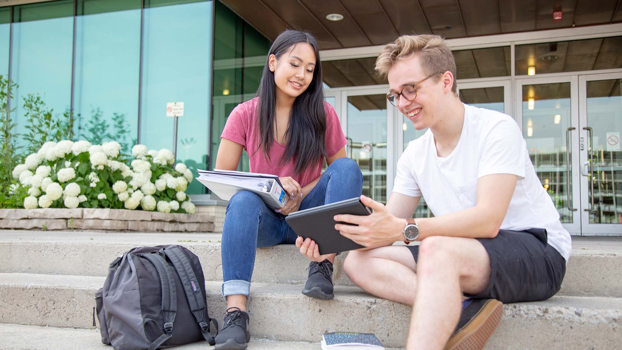 students on building stairs