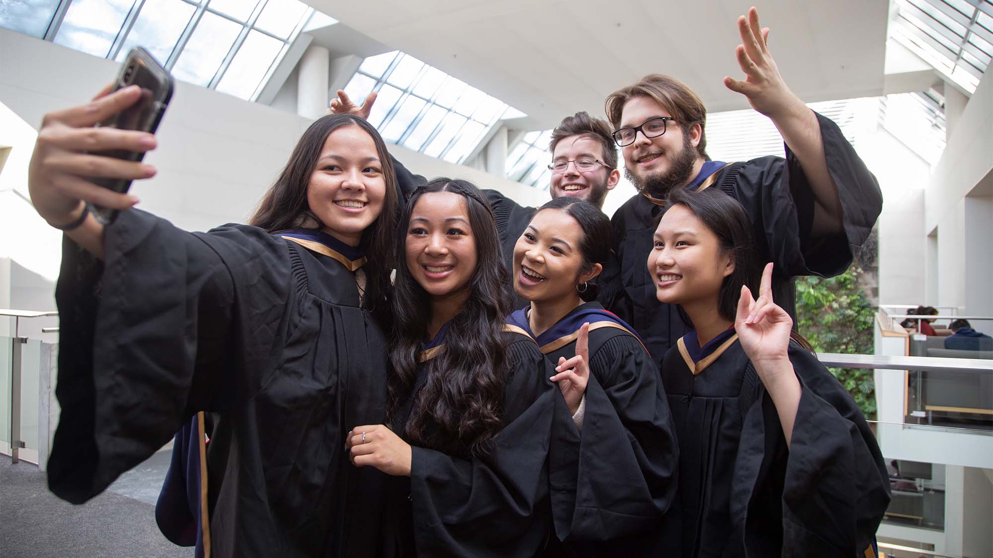 students in grad gowns