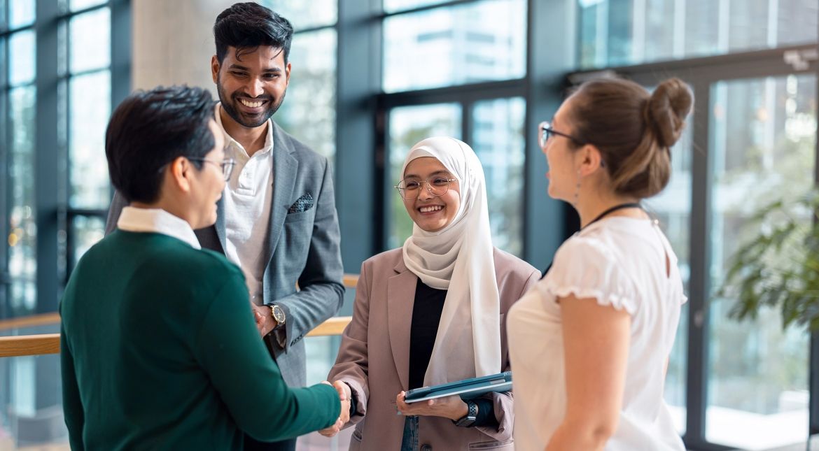 Young professionals shaking hands