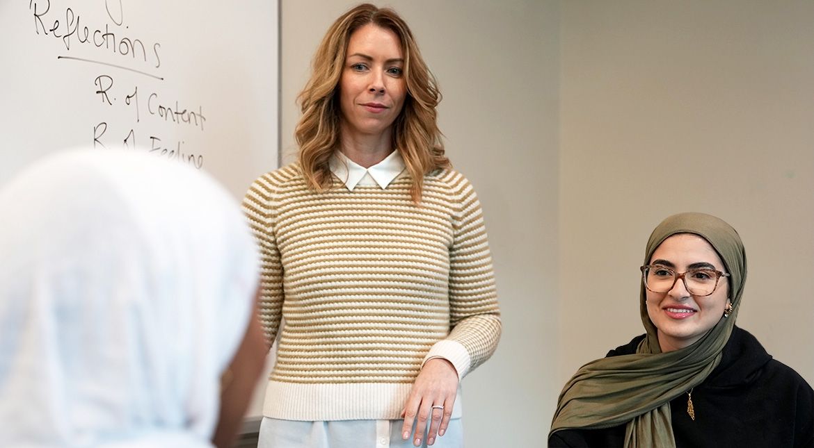 Instructor giving workshop to two students