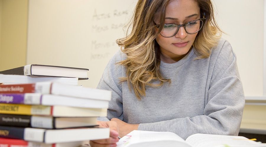 Student reading textbook